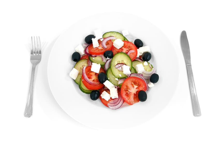 closeup photo of salad with dressing on white ceramic plate HD wallpaper