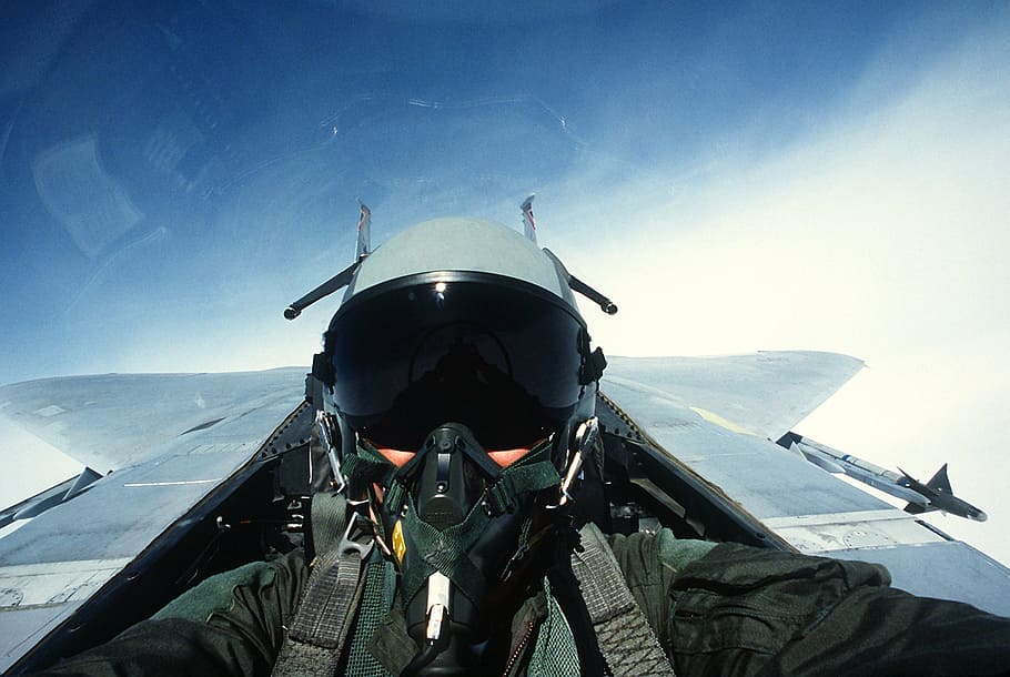 pilot riding plane during daytime, fighter jet, fighter pilot