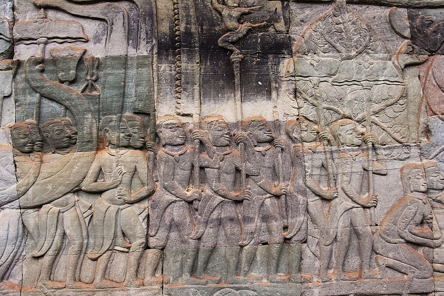 gray and brown embossed wall decor at daytime, bayon temple, travel