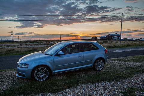 An Audi A3 S-Line sits at sunset on the Kent Coast in the South of England. HD wallpaper