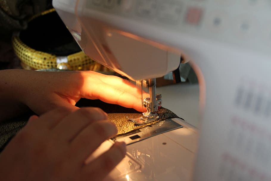 white sewing machine, thread, clothing, fabric, needle, seamstress