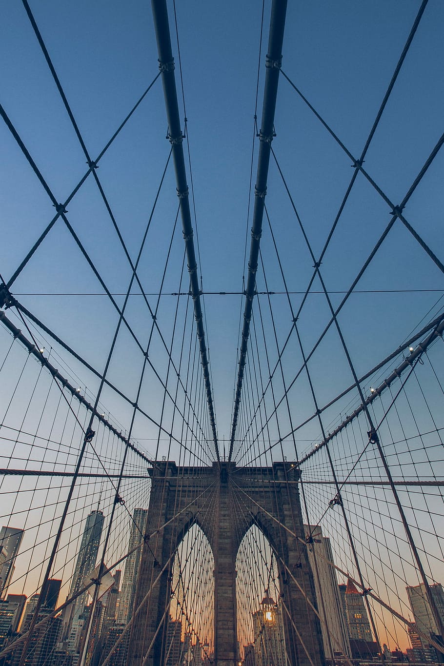 worm's eye view of suspension bridge under blue sky during sunrise HD wallpaper