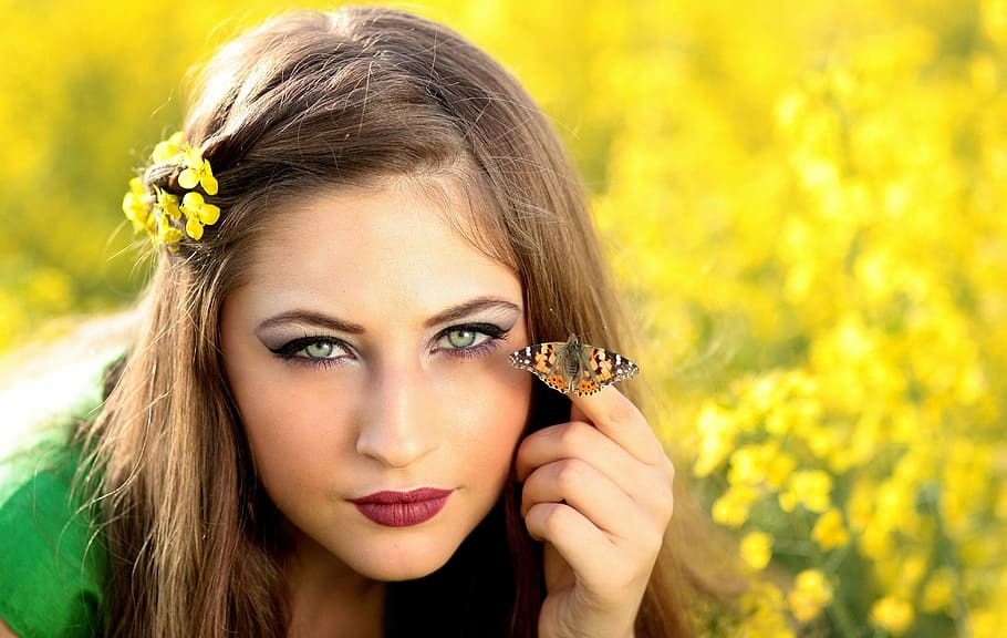 woman wearing green top with brown and black butterfly on her hand at daytime, HD wallpaper