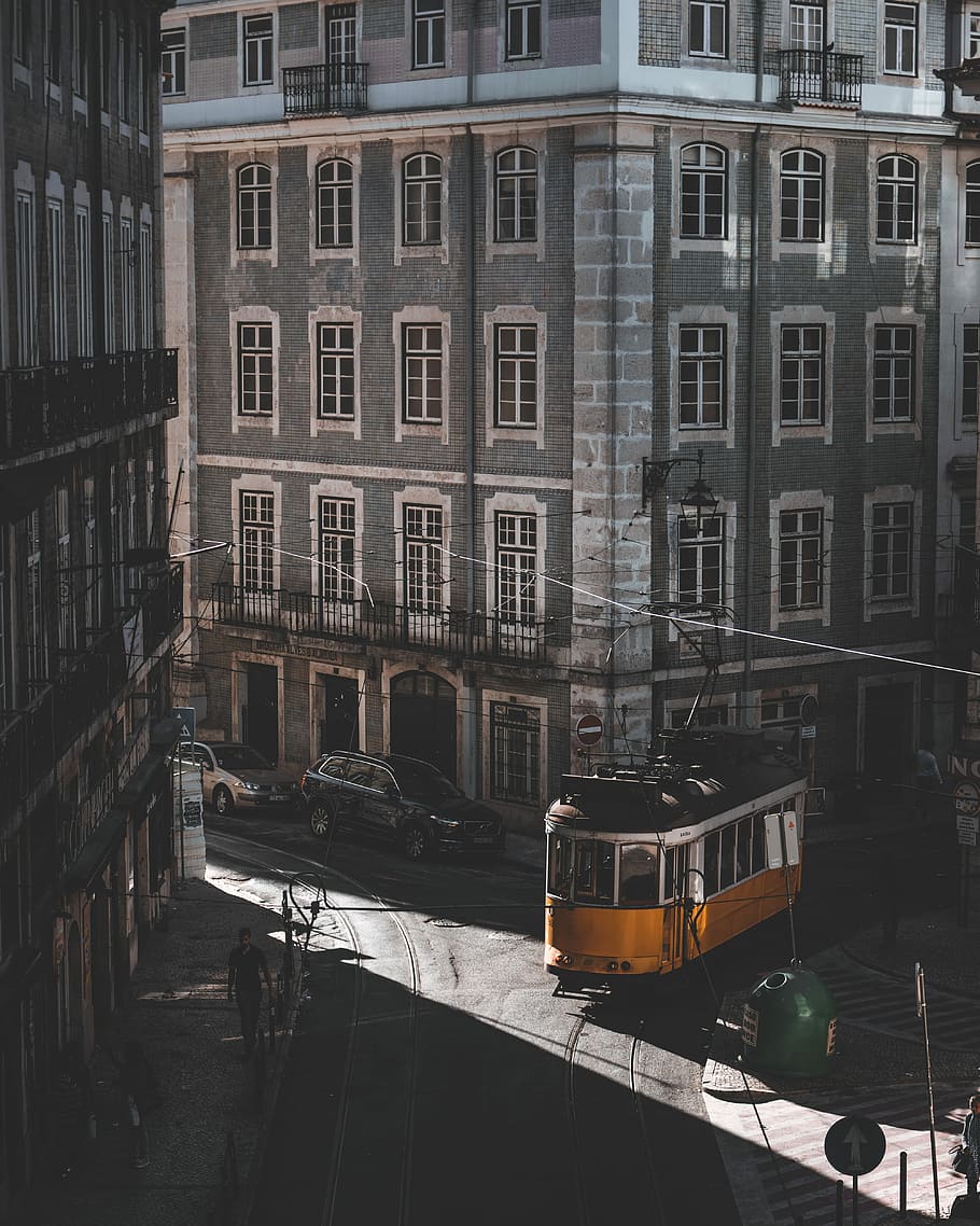 yellow tram roaming on street, yellow tram passing beside building, HD wallpaper