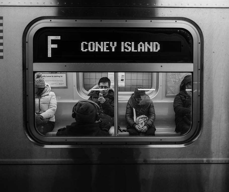 grayscale photo of persons sitting on train, group of people sitting inside train HD wallpaper