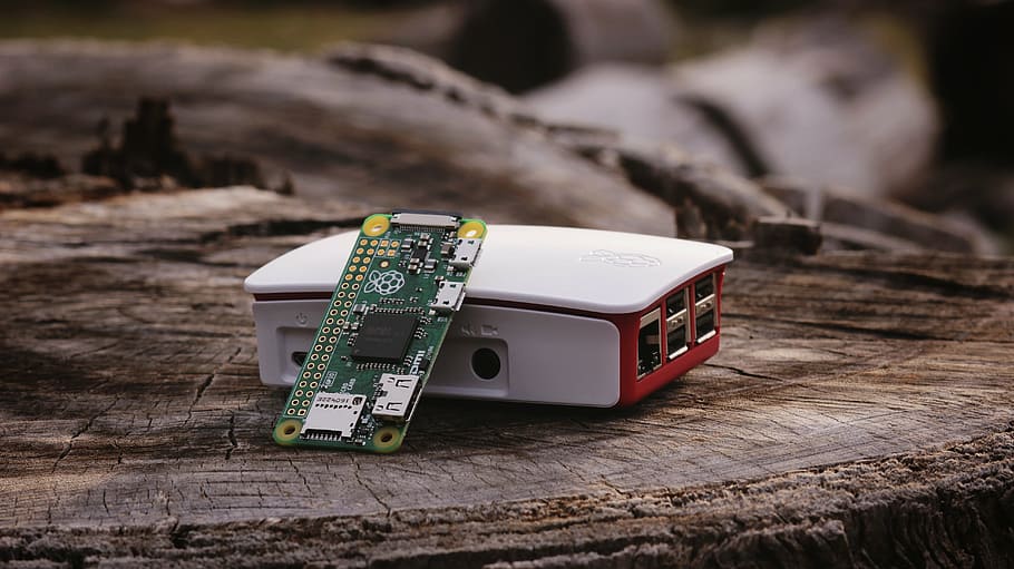 white LED projector and microchip board on tree stomp, raspberry pi, HD wallpaper