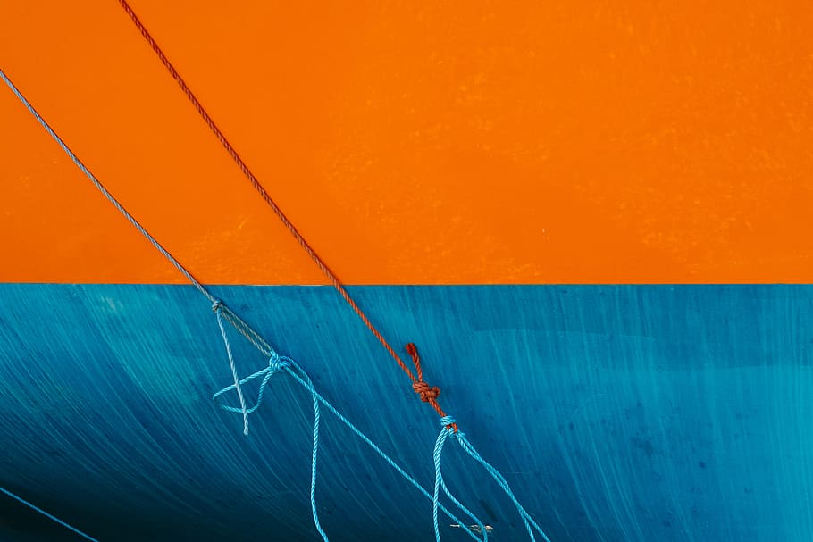 blue and orange ropes on wall, contrast, paint, no people, orange color
