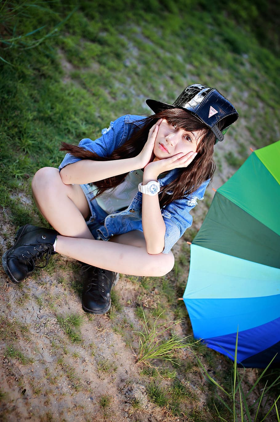 woman sitting on green grass near umbrella, girl, teen, teen girl