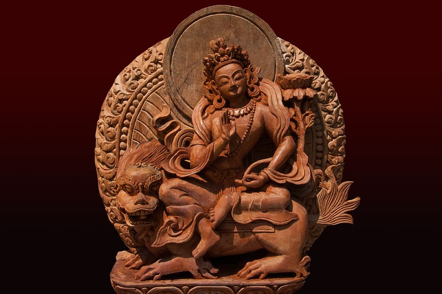 wooden carved woman on animal figurine, tara, female, peaceful