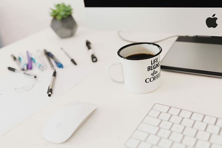white iMac on top of desk, white ceramic mug on table, coffee HD wallpaper