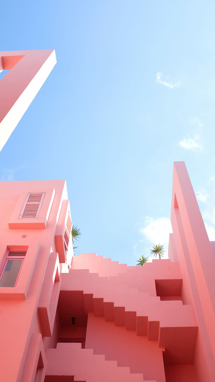 white concrete building, pink concrete house photography under the blue sky HD wallpaper