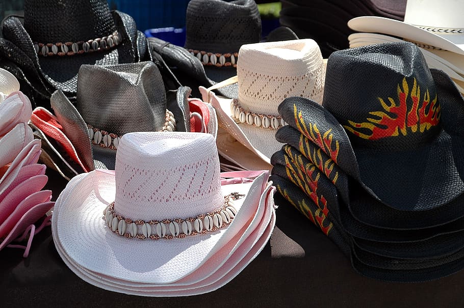 assorted-color cowboy hats on black textile, for sale, country