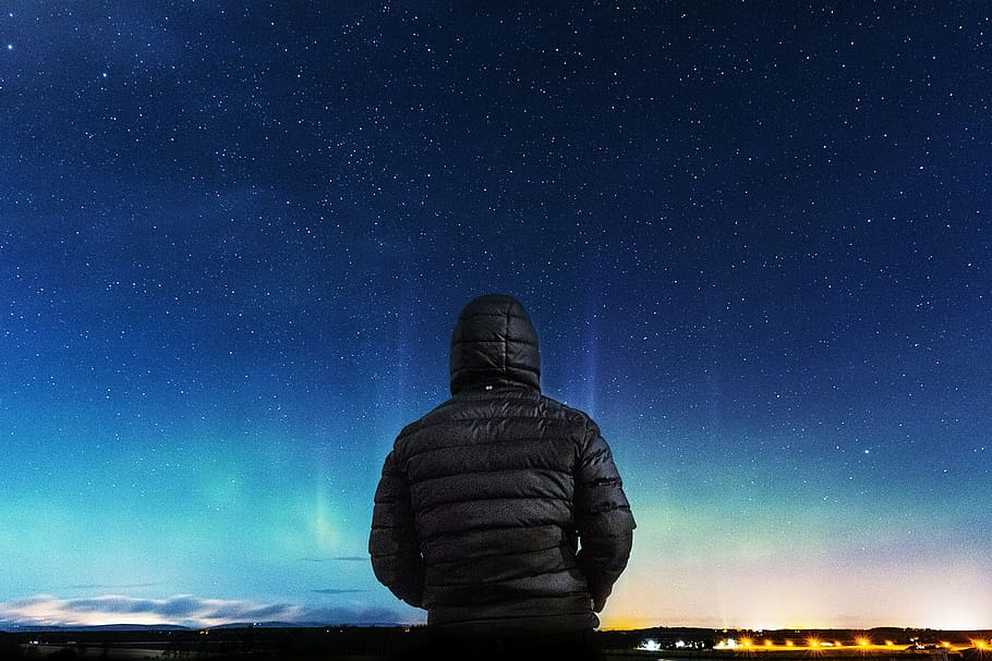 person in black bubble jacket sitting, nght sky, night, man, warm, HD wallpaper