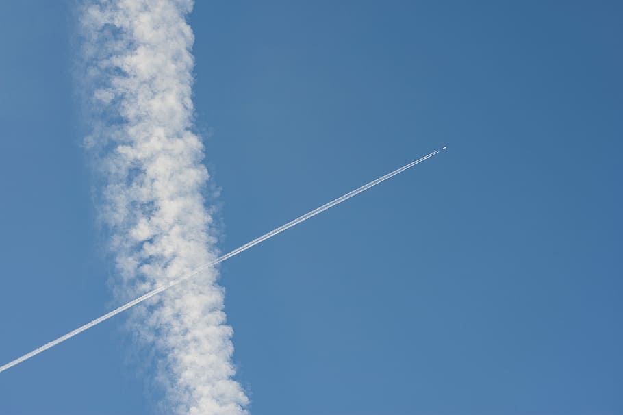 aircraft vehicle flyon the sky, jet with smoke trail on blue sky