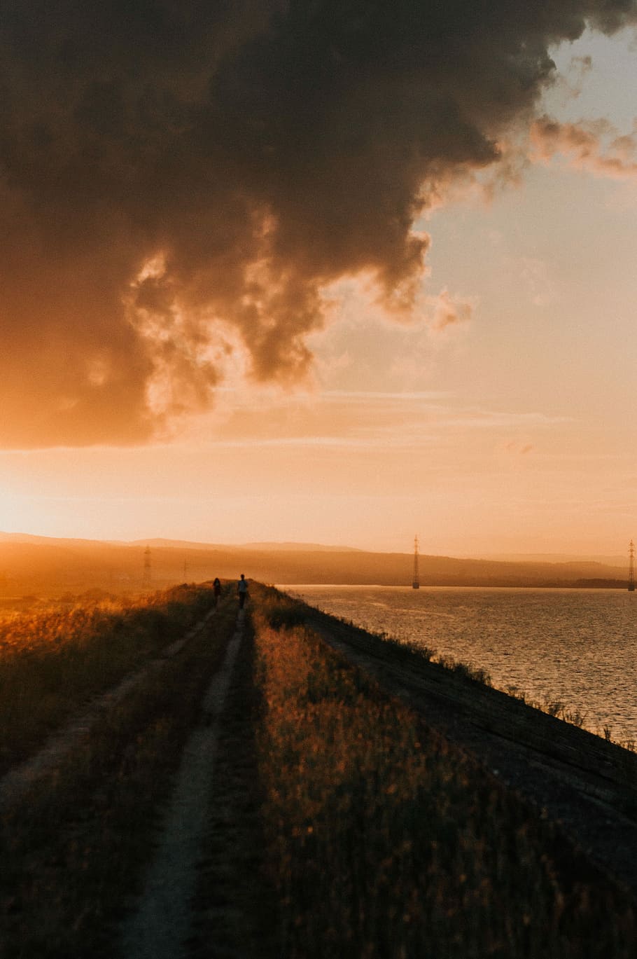 two person walking on road during daytime, two person walking near ocean during daytime HD wallpaper