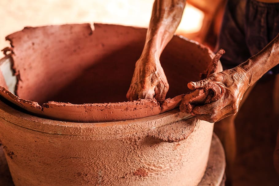 person holding brown clay pot, pottery, craft, workers, art, west