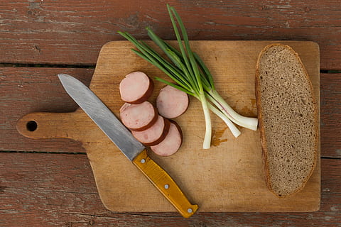 celery placed near bread and knife on to of chopping board HD wallpaper