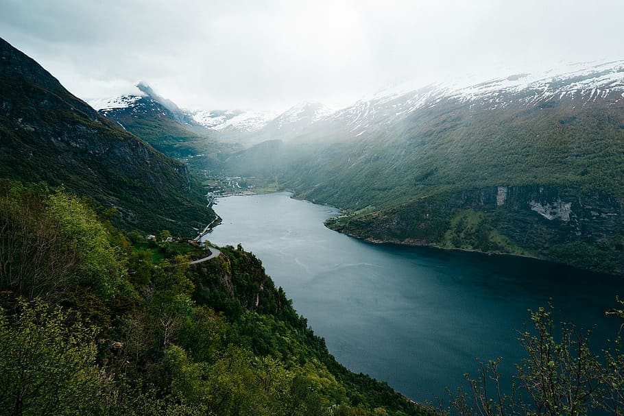 aerial photo of calm large body of water between mountains HD wallpaper