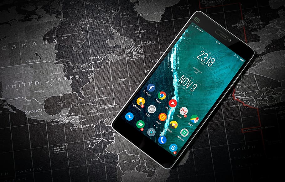 black Xioami Android smartphone on top of world map illustration HD wallpaper