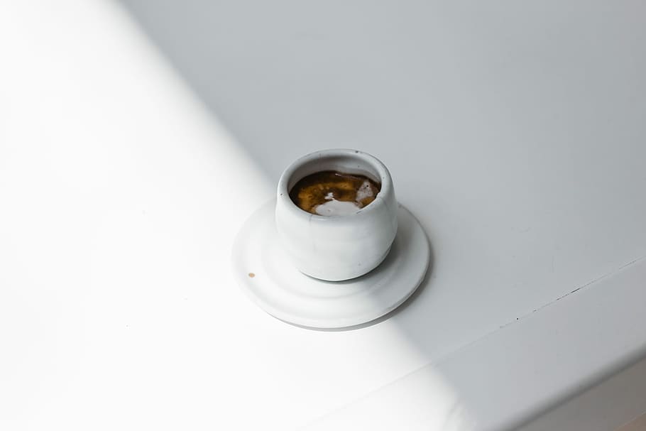 white teacup on saucer, top view photography of mug filled with brown beverage HD wallpaper