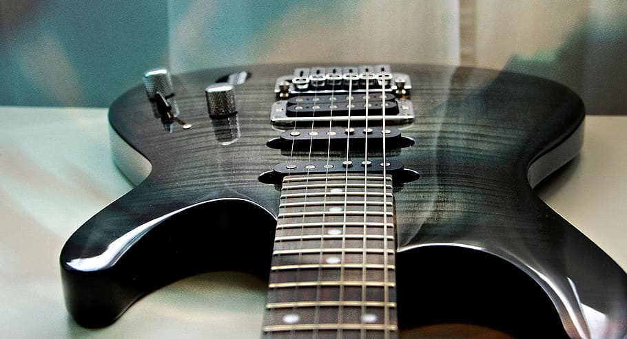 black electric guitar on table, stringed instrument, musical instrument, HD wallpaper