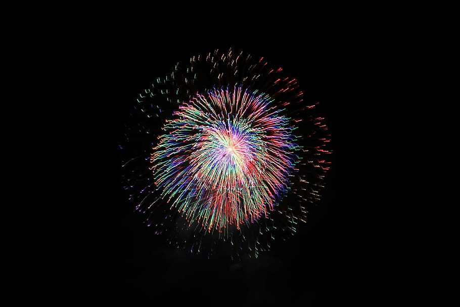low angle photo of yellow, pink, and blue fireworks, night, exploding