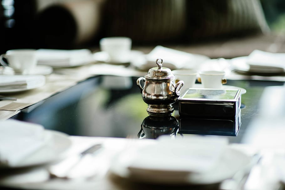 selective focus photography of teapot on table, stainless steel continer beside black box HD wallpaper