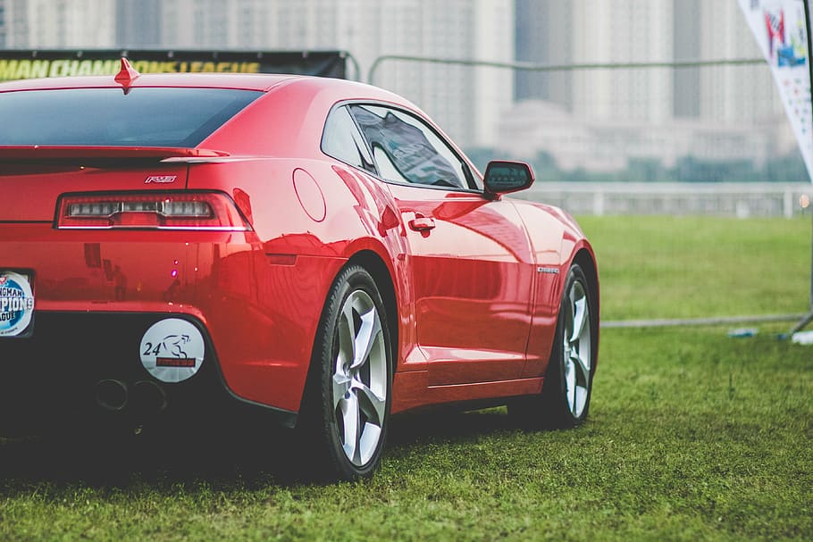 red coupe parked near signage, car, dubai, uae, performance HD wallpaper