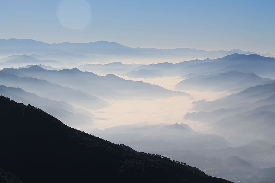aerial photography of mountain range covered in clouds at daytime, silhouette high-angle photography of valley surrounded by mountain ranges view from top of mountain during daytime HD wallpaper