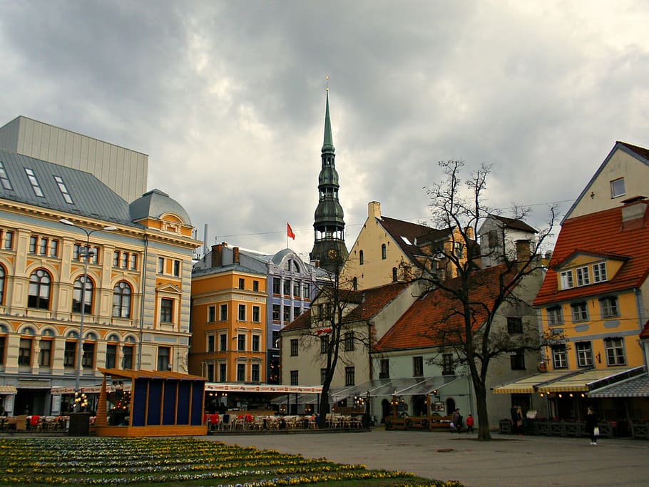 trees near houses under dark clouds, riga, latvia, city, square HD wallpaper