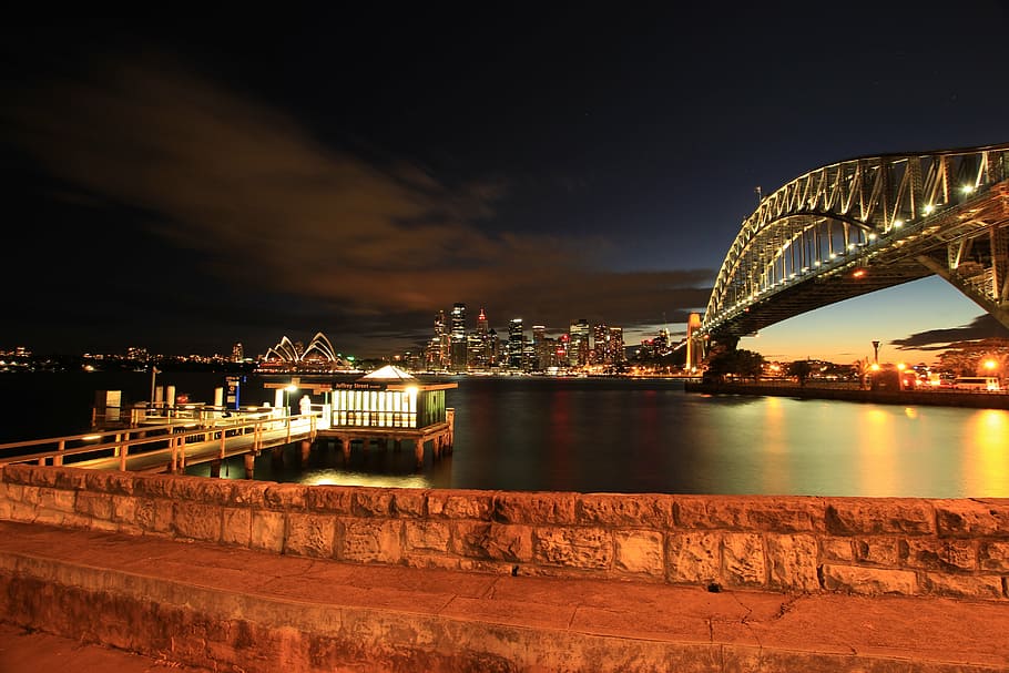 green and white lighted house near bridge at nighttime, wall HD wallpaper