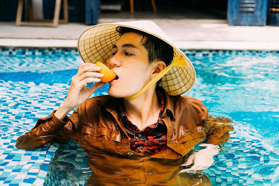 man wearing brown dress shirt in pool during daytime, orange HD wallpaper