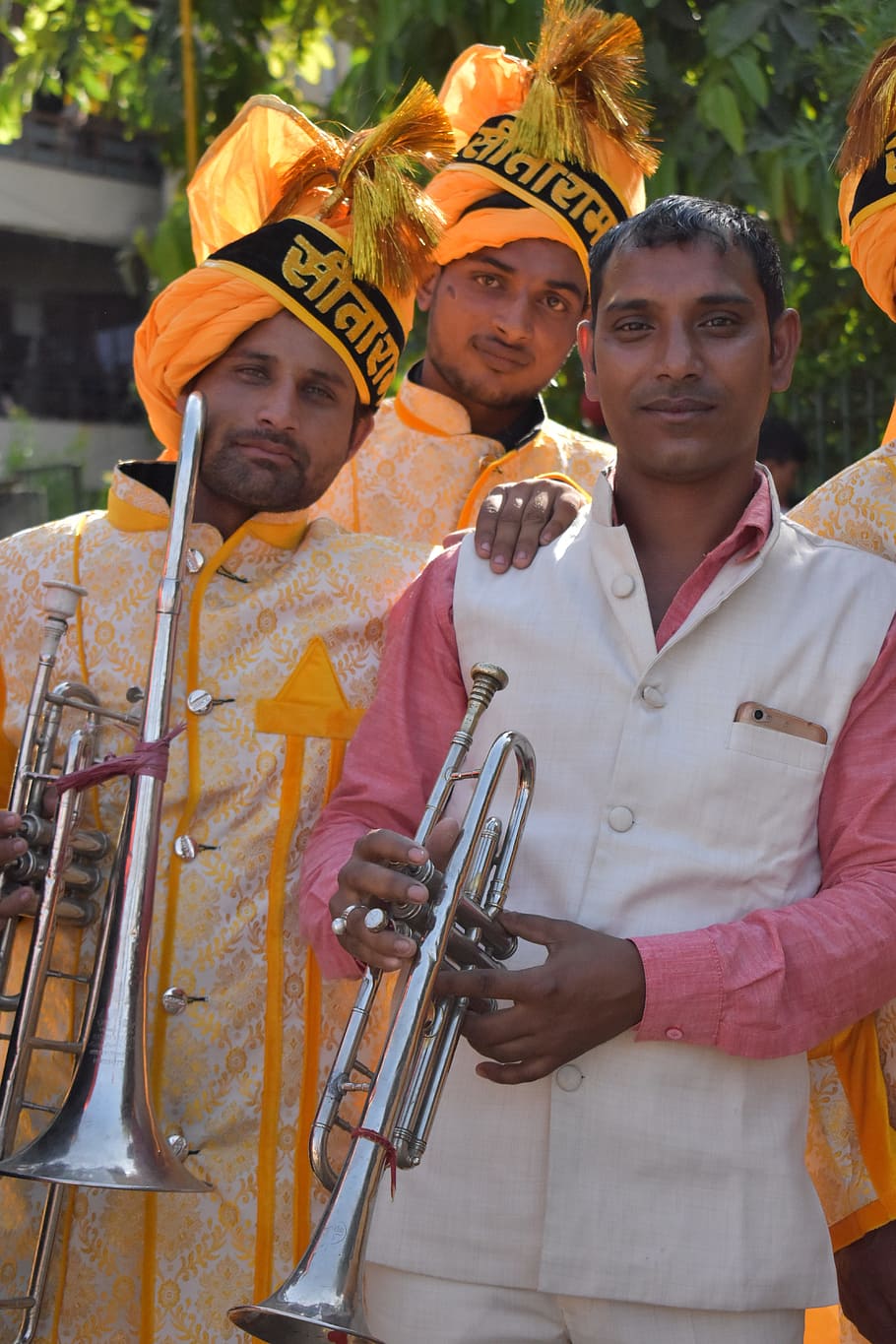 a musical ensemble, instrumental band, indians, portrait, looking at camera