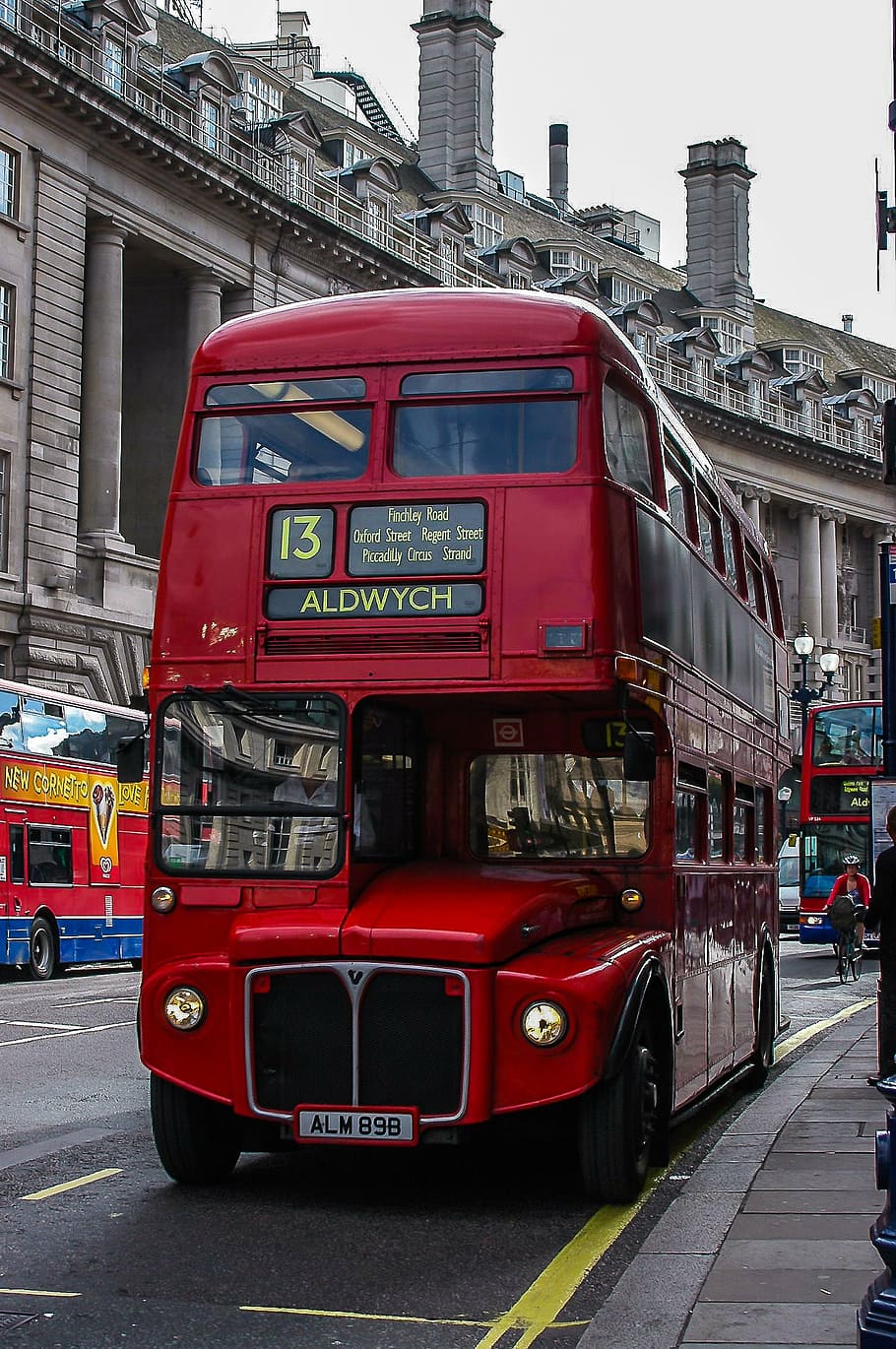 closeup photo of red and black 2-storey bus, london, britain