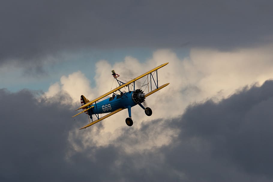 biplane, flying, propeller, oldtimer, heavy cloud, air vehicle HD wallpaper