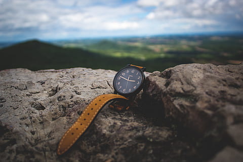 round black analog watch on stone, round black and brown analog watch on brown rock HD wallpaper