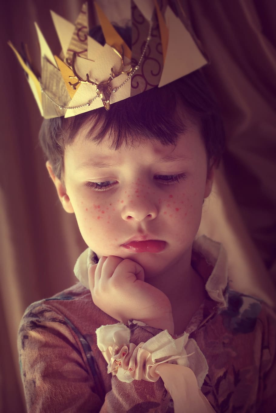boy wearing paper crown, prince, kids, magic, a cute baby, story