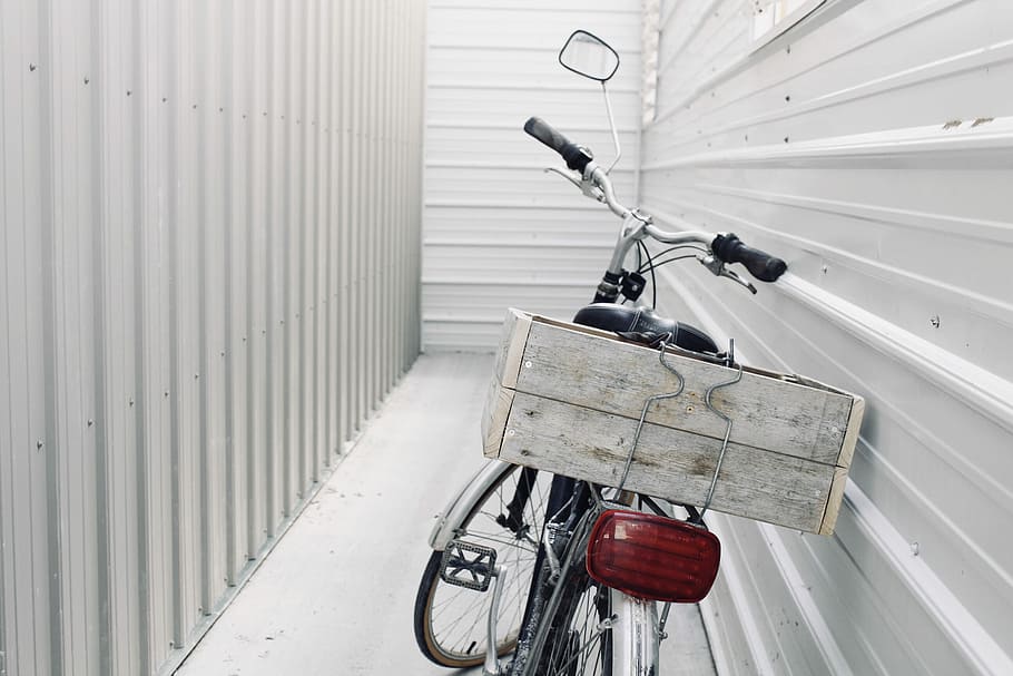 gray and black road bike, white and black leaning bicycle in gray metalwall HD wallpaper
