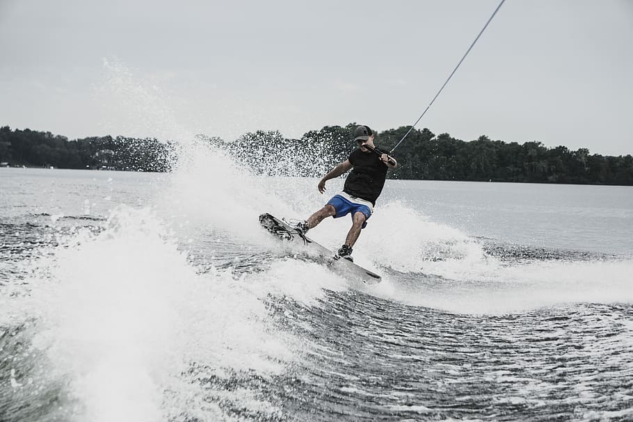 man paragliding, man wakeboarding during daytime, water, waves HD wallpaper