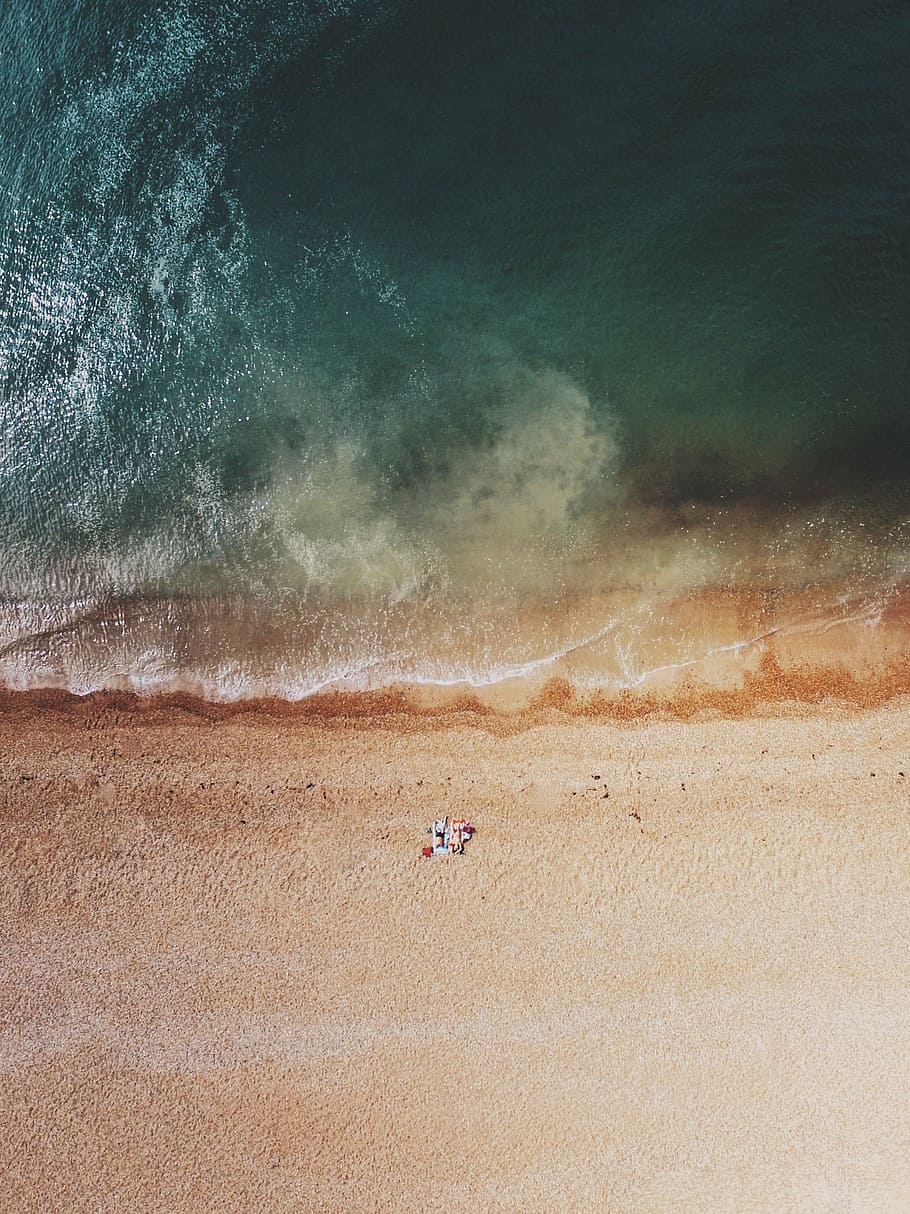 aerial photo of person standing on shore during daytime, sea HD wallpaper