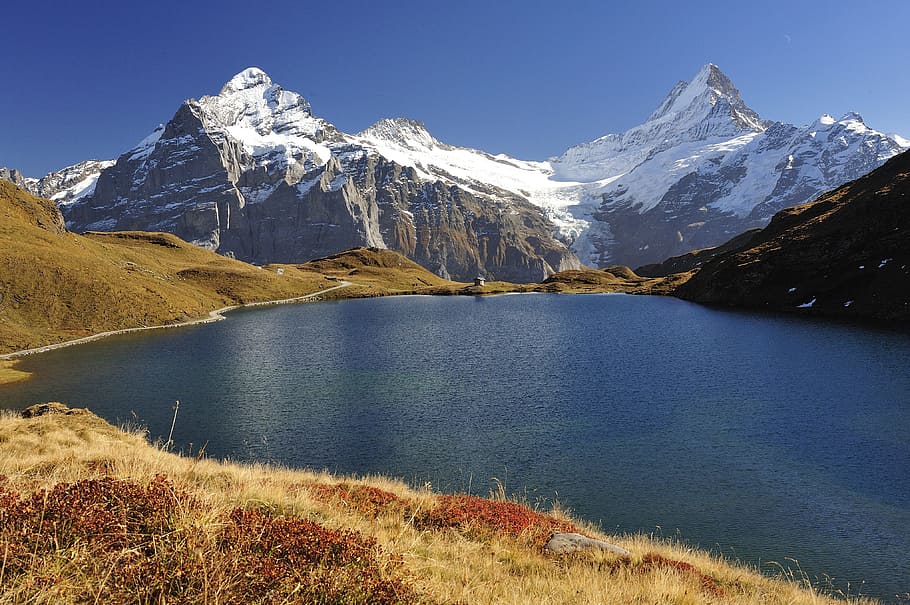 blue body of water in front of mountains, bachalpsee, bernese horns