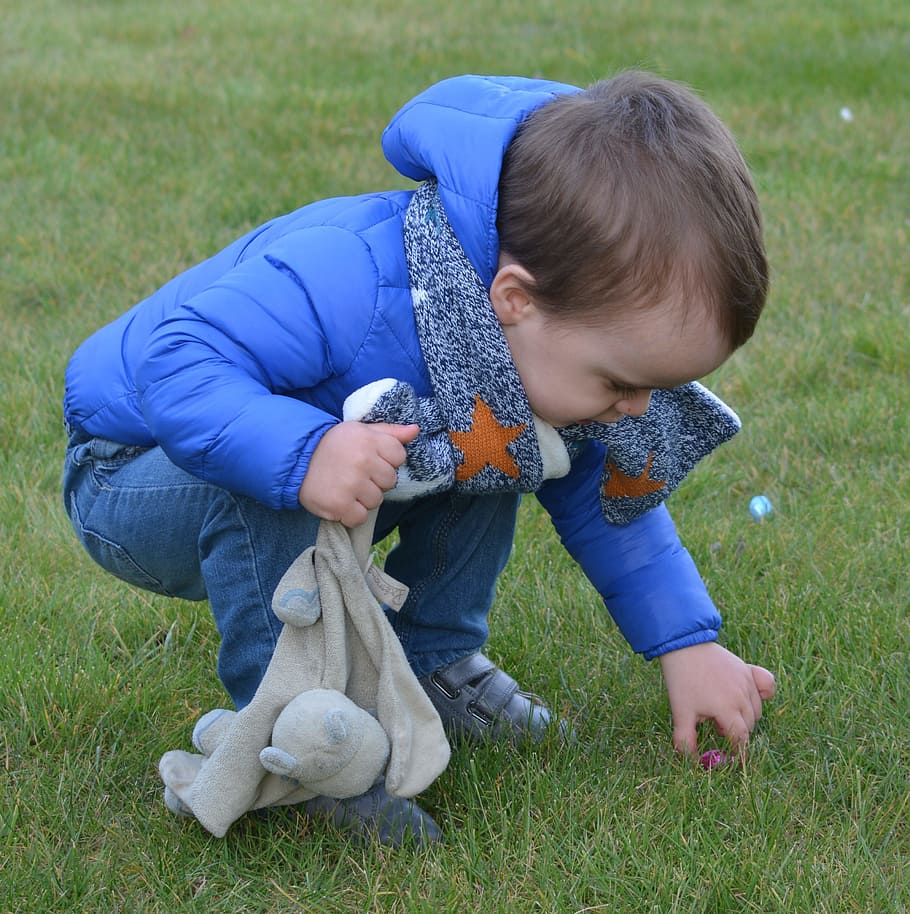 toddler picking up a red pebbl on grass, Child, Boy, Easter Eggs HD wallpaper