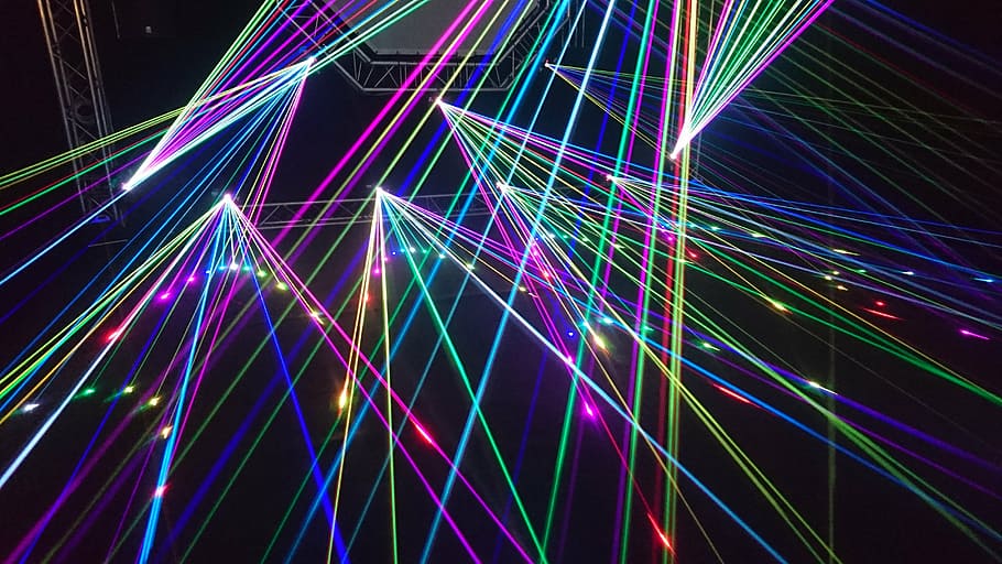 multicolored disco light rays on black background, lightshow