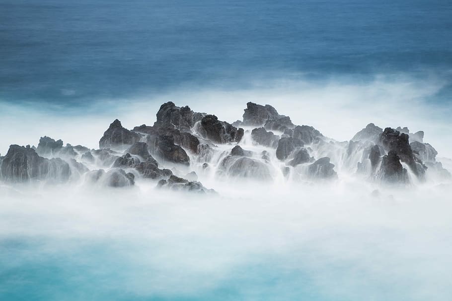 photo of sea waves hitting stones, water wave on the rock, mountain peak HD wallpaper