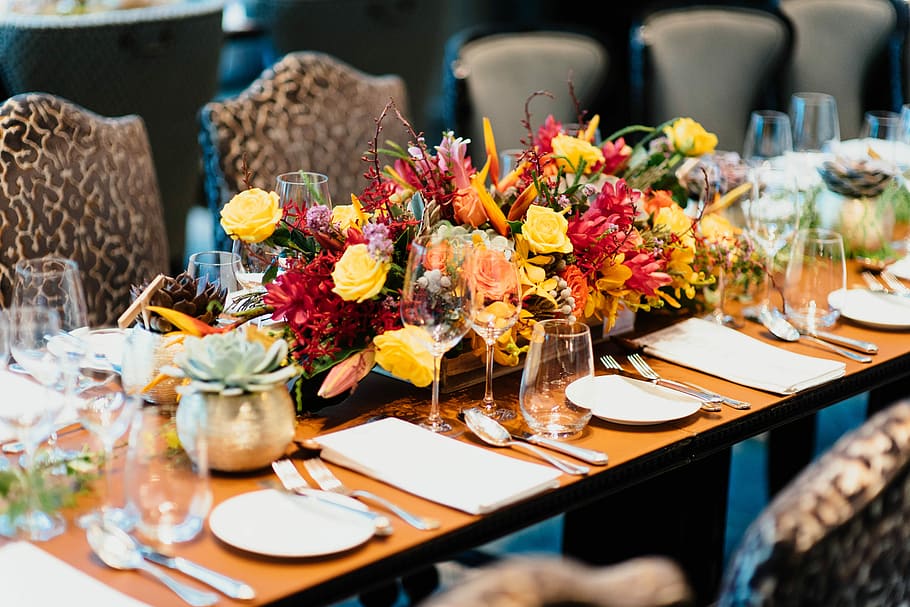 selective focus photography of wine glasses on table, red and yellow flower arrangement HD wallpaper
