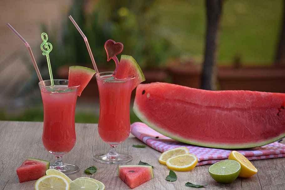 slice of watermelon and fruit cocktails on top of table, food