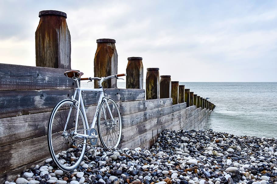 white bicycle at the side of brown wooden dock, white hardtail bicycle beside brown and black wooden dock, HD wallpaper