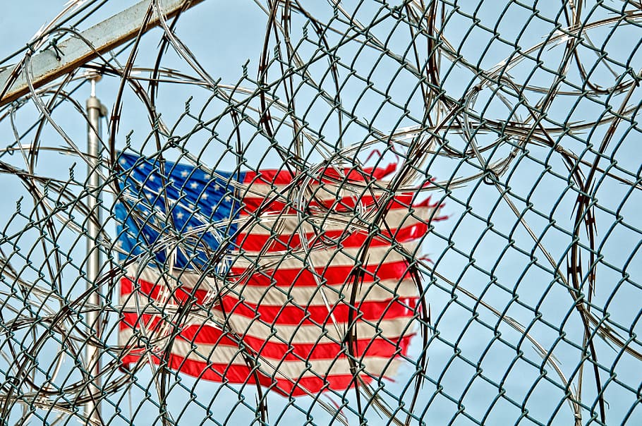 American flag beside gray wire link fence with live wire fence at daytime, HD wallpaper