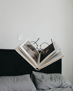 black framed eyeglasses between opened book, eyeglasses on top of open book HD wallpaper