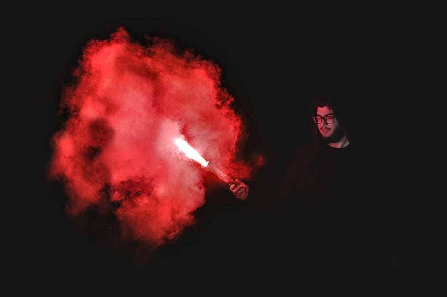 person holding red flare, people, man, guy, dark, night, torch, HD wallpaper